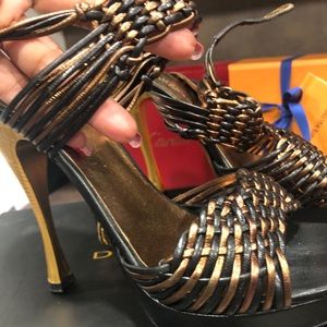 Donna Karan braided leather gold platform heels.